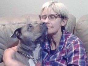 Tamra McBeath-Riley, 52, with her dog Raya. Her friends are still missing.