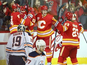 Flames celebrate Johnny Gaudreau's (13) first period goal during NHL action between the Edmonton Oilers and the Calgary Flames in Calgary on Saturday, January 11, 2020. Jim Wells/Postmedia