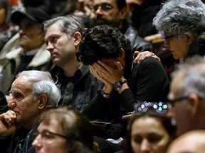 Calgarians mourn at a memorial at the University of Calgary on Sunday, Jan. 12, 2020, to honour the memory of those killed in the airliner shot down outside Tehran, Iran.