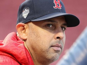 BOSTON, MA - OCTOBER 22:  Manager Alex Cora of the Boston Red Sox looks on during team workouts ahead of the 2018 World Series at Fenway Park on October 22, 2018 in Boston, Massachusetts.  (Photo by Elsa/Getty Images)