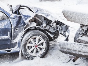 Crashed cars right after an accident on winter road with snow. Stock photo Getty Images. Insurance rates, Alberta, Car insurance