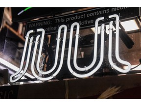 A sign advertising JUUL products is displayed in a store on December 19, 2019 in New York City.