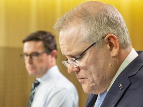 SYDNEY, AUSTRALIA - JANUARY 02: Prime Minister Scott Morrison (R) and Minister for Water Resources, Drought, Rural Finance, Natural Disaster and Emergency Management, David Littleproud speak during a press conference on January 02, 2020 in Sydney, Australia. Bushfires across New South Wales and Victoria have killed at least 10 people since Christmas day following devastating fires in the NSW South Coast and East Gippsland in Victoria. The Prime Minister attended the funeral for NSW volunteer firefighter Geoffrey Keaton who was killed along with his colleague Andrew O'Dwyer on 19 December 2019 when a tree fell into the path of their tanker, causing it to roll, as they were travelling in a convoy near the town of Buxton. (Photo by Jenny Evans/Getty Images)