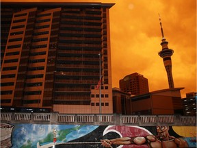 AUCKLAND, NEW ZEALAND - JANUARY 05: An orange glow darkens the sky at 5pm in Auckland city on January 05, 2020 in Auckland, New Zealand. The smoke has travelled from Australia, where hundreds of fires continue to burn across New South Wales, Victoria and South Australia, with the Australian Defence Force now called in to help with firefighting and rescue efforts. 14 people have died in the fires in NSW, Victoria and SA since New Year's Eve.