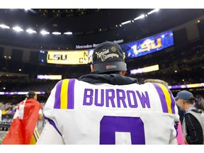 Quarterback Joe Burrow of the LSU Tigers celebrates after defeating the Clemson Tigers 42-25 in the College Football Playoff National Championship game at Mercedes Benz Superdome on Monday in New Orleans.