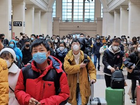 People wear face masks as they wait at Hankou Railway Station on January 22, 2020 in Wuhan, China. A new infectious coronavirus known as "2019-nCoV" was discovered in Wuhan last week. Health officials stepped up efforts to contain the spread of the pneumonia-like disease which medical experts confirmed can be passed from human to human. Cases have been reported in other countries including the United States,Thailand, Japan, Taiwan, and South Korea. It is reported that Wuhan will suspend all public transportation at 10 AM on January 23, 2020.