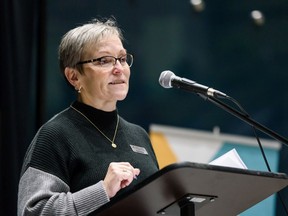 Diana Krecsy, Calgary Homeless Foundation president and CEO, speaks during the city-wide candlelight memorial service held in the Atrium of the Calgary Municipal Building in memory of those who have passed away while experiencing homelessness on Saturday, Dec. 21, 2019.