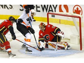 Calgary Flames goalie David Rittich stops the Philadelphia Flyers in third period NHL action at the Scotiabank Saddledome in Calgary on Tuesday, October 15, 2019. Darren Makowichuk/Postmedia