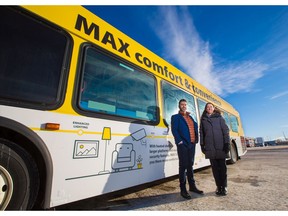Asif Kurji, Calgary Transit's acting manager of transit planning and Anne Cataford, manager, major transit projects stand next to a Max Yellow bus on Monday December 16, 2019. Calgary Transit announced that the long awaited southwest BRT Max Yellow line with start operating on December 23. Gavin Young/Postmedia