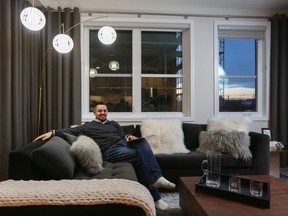 Connor Holland, 30, in the tidy new condo he recently purchased in the Apollo at Greenwich by Cove Properties.