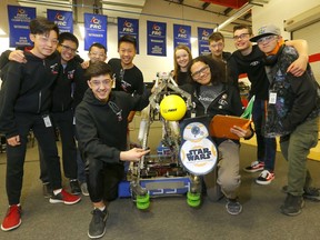 Front L-R, Zoof Abdurashidov from Team 5015 and Cool Kornak from Team 4334 are part of First Robotics Competition (FRC) for students in grades 9 to 12.