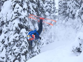 Young Leo flying through the forest upside down on the CMH Kootenay Lodge heli-ski tour. Photo, Andrew Penner