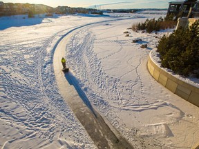 The ice on Calgary's Lake Mahogany gets an early morning sweep. It is one of the lake communities on offer in Calgary.