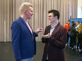 Mark Hall, left, and actor Evan Kinnane (who portrays Hall) chat during rehearsal on Jan. 17, 2020 for Theatre Calgary's production of the musical The Louder We Get. The show follows the true story of Hall as he  fought for the right to take his boyfriend to his high school prom. Jim Wells/Postmedia