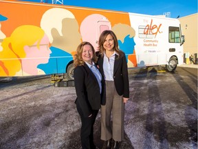 Joy Bowen-Eyre, CEO with The Alex, left and Jill Schnarr, vice-president corporate citizenship with TELUS stand in front of the newest Alex Community Health Bus purchased with the help of TELUS. The bus was unveiled on Tuesday, January 21, 2020.  Gavin Young/Postmedia