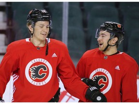 Calgary Flames forward Matthew Tkachuk laughs with teammate Andrew Mangiapane during team practice on Monday, January 27, 2020. Gavin Young/Postmedia