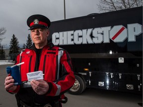 Const. Andrew Fairman, with the Calgary Police Service alcohol and drug recognition unit, shows a roadside breath-screening device on Thursday, January 30, 2020. The Calgary Police Service announced it is expanding mandatory alcohol screening in the city.