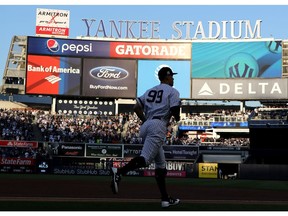 Aaron Judge of the New York Yankees takes the field against the Houston Astros in Game Five of the American League Championship Series at Yankee Stadium on October 18, 2017 in the Bronx borough of New York City.