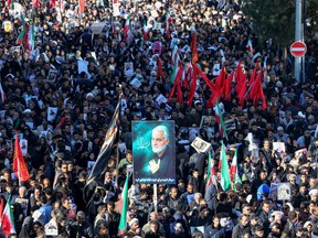 Iranian mourners gather during the final stage of funeral processions for slain top general Qasem Soleimani, in his hometown Kerman on January 7, 2020.