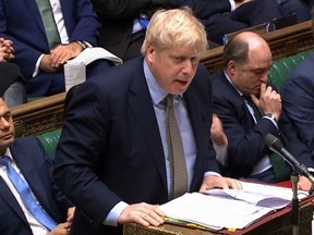 A video grab from footage broadcast by the UK Parliament's Parliamentary Recording Unit (PRU) shows Britain's Prime Minister Boris Johnson as he speaks during Prime Minister's Question time (PMQs) in the House of Commons in London on January 8, 2020. (Photo by HO / PRU / AFP)