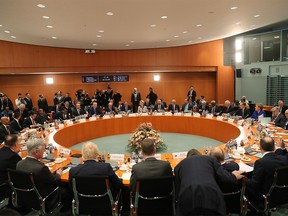 A handout picture taken and released on January 19 , 2020 in Berlin by the Turkish Presidential Press Service shows world leaders sit at the start of a Peace summit on Libya at the Chancellery in Berlin. (Photo by Murat CETINMUHURDAR / TURKISH PRESIDENTIAL PRESS SERVICE / AFP)