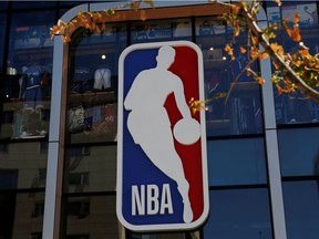 FILE PHOTO: An NBA logo is seen on the facade of its flagship store at the Wangfujing shopping street in Beijing, China October 8, 2019.