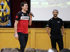 Canadian Olympic speed skaters Denny Morrison, left and Gilmore Junio talk to students at Holy Name School in Calgary on Thursday, January 30, 2020.  Gavin Young/Postmedia