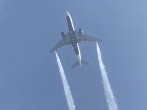 A Delta Airlines, Flight 89, Boeing 777-200 jet empties its fuel tanks as it makes an emergency landing at Los Angeles International Airport, seen from Ocean View Elementary School in Whittier, California, U.S., January 14, 2020 in this still video image obtained by REUTERS.