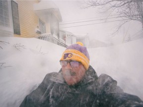A man is pictured in a snowy street in St. John's, Newfoundland and Labrador, Canada January 17, 2020. Zach Bonnell/via REUTERS THIS IMAGE HAS BEEN SUPPLIED BY A THIRD PARTY. MANDATORY CREDIT. NO RESALES. NO ARCHIVES. ORG XMIT: UGC101