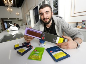 Adam Chammorry displays some of the edibles available at Queen of Bud in Calgary on Monday, Jan. 13, 2020.