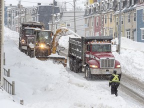 Workers continue to remove snow from the streets in St. John's on Tuesday, January 21, 2020. The state of emergency ordered by the City of St. John's continues for a fifth day, leaving most businesses closed and most vehicles off the roads in the aftermath of the major winter storm that hit the Newfoundland and Labrador capital.