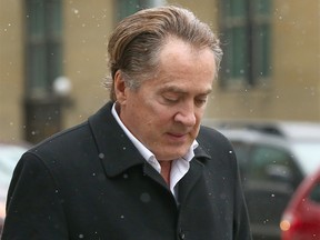 Calgary businessman Ken Carter leaves court in Calgary on Oct. 9, 2018.