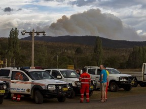 Smoke is seen from the Good Good fire on January 23, 2020 in Cooma, Australia. on January 23, 2020 in Cooma, Australia. Three American firefighters have have died after their C-130 water tanker plane crashed while battling a bushfire near Cooma in southern NSW.