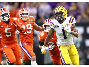 Jan 13, 2020; New Orleans, Louisiana, USA; LSU Tigers wide receiver Ja'Marr Chase (1) runs with the ball against the Clemson Tigers in the fourth quarter in the College Football Playoff national championship game at Mercedes-Benz Superdome. Mandatory Credit: Mark J. Rebilas-USA TODAY Sports ORG XMIT: USATSI-406517