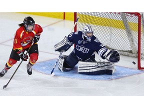 Mount Royal University Cougars goaltender Zoe De Beauville tracks a puck as it flies across the crease during the 2018 Crowchild Classic at the Scotiabank Saddledome. Postmedia file photo.