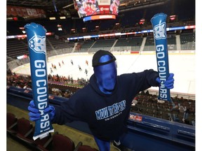 Fan Doug Thomas cheers on his Mount Royal Cougars to no avail during last winter's Crowchild Classic. Postmedia file photo.