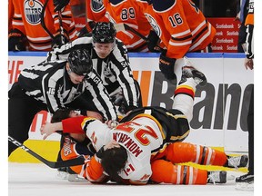 Jan 29, 2020; Edmonton, Alberta, CAN; Edmonton Oilers forward Ryan Nugent-Hopkins (93) and Calgary Flames forward Sean Monahan (23) fight during the first period at Rogers Place. Mandatory Credit: Perry Nelson-USA TODAY Sports ORG XMIT: USATSI-405773