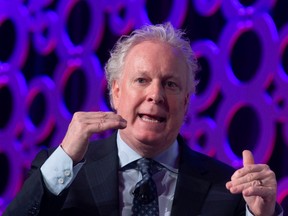 Jean Charest speaks during a panel discussion at the Canadian Aerospace Summit in Ottawa on Wednesday November 13, 2019.
