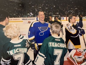Brady and Matthew, with dad Keith Tkachuk at the 2004 NHL All-Star game in Saint Paul, Minn.