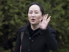 Meng Wanzhou, chief financial officer of Huawei, leaves her home in Vancouver, Monday, Jan. 20, 2020. A court hearing began today over the American request to extradite Meng on fraud charges.