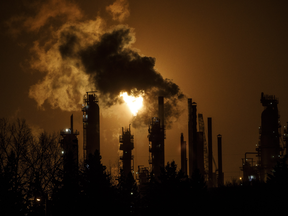 A flare stack lights the sky from an oil refinery in Edmonton.