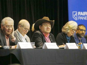 Jason Goodstriker, centre, participates in a public hearing with the Fair Deal panel.