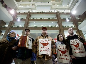 Members of Beaver Hills Warriors and Extinction Rebellion Edmonton protest expansion of the oilsands, specifically the Teck Frontier Mine, inside Canada Place, in Edmonton on Wednesday, Jan. 22, 2020.