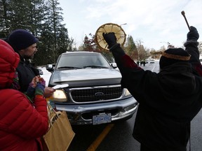 Supporters of the Wet'suwet'en nation indigenous group who oppose the construction of the Coastal GasLink pipeline, protest by blocking a road outside the provincial headquarters of the Royal Canadian Mounted Police in Surrey, British Columbia, Canada Jan. 16, 2020.