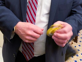 U.S. Senator Mike Rounds plays with a fidget spinner handed out to Republican senators at their weekly policy lunch to keep them occupied during the Senate impeachment trial of U.S. President Donald Trump at the U.S. Capitol in Washington, U.S., January 23, 2020.