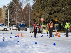 Police investigate the scene in Bowness where a woman was found in distress and later died on Monday, February 10, 2020. Azin Ghaffari/Postmedia