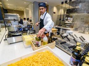 Raj Nandamudi, culinary development chef, prepares pasta at the Sunterra Market in Banker Hall in Calgary on Monday, February 10, 2020. Azin Ghaffari/Postmedia