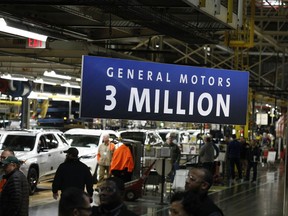 The U.S. is riding a long period of economic growth, while Canada argues over major infrastructure projects, says columnist. A sign proclaims the three millionth vehicle produced at the General Motors Lansing Delta Township assembly plant on February 21, 2020, in Lansing, Mich.