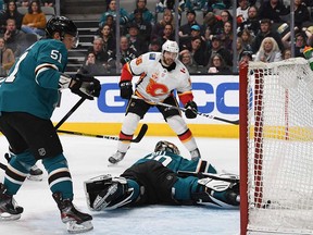 The Flames Tobias Rieder scores against the San Jose Sharks on Feb. 10, 2020.