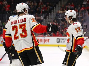 DETROIT, MICHIGAN - FEBRUARY 23: Johnny Gaudreau #13 of the Calgary Flames celebrates his first period gaol with Sean Monahan #23 of the Calgary Flames while playing the Detroit Red Wings at Little Caesars Arena on February 23, 2020 in Detroit, Michigan. (Photo by Gregory Shamus/Getty Images)